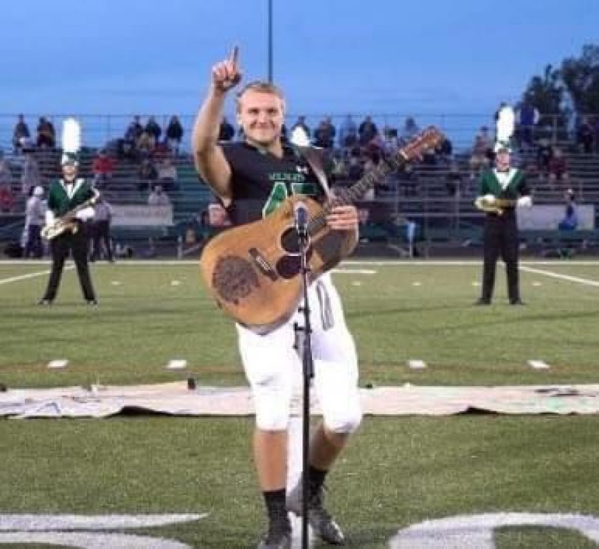 Because no one wanted to sing the national anthem, one high school kid removed his helmet and picked up a guitar